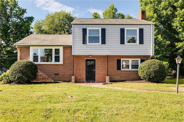 619 Winnetka Ave, Richmond, VA 23227 - split level home with brick siding, a chimney, and a front yard