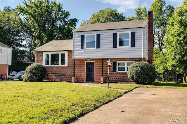 619 Winnetka Ave, Richmond, VA 23227 - tri-level home featuring brick siding, a chimney, and a front yard