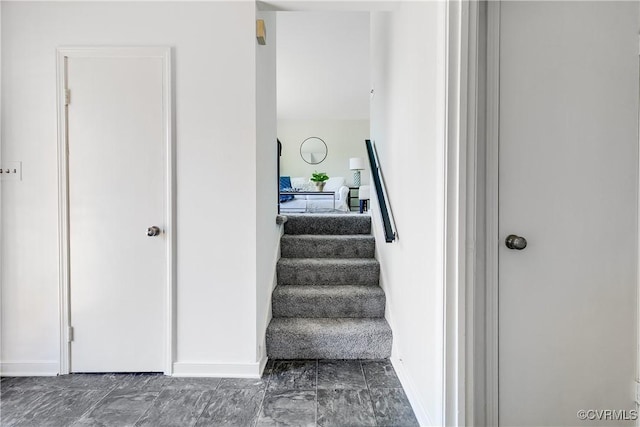 619 Winnetka Ave, Richmond, VA 23227 - stairway with baseboards and marble look tiles