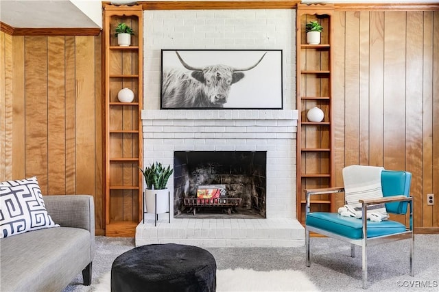 619 Winnetka Ave, Richmond, VA 23227 - carpeted living room with a brick fireplace and wood walls
