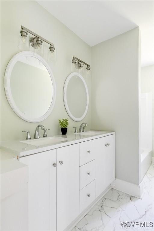 619 Winnetka Ave, Richmond, VA 23227 - bathroom featuring double vanity, marble look tile flooring, and a tub to relax in