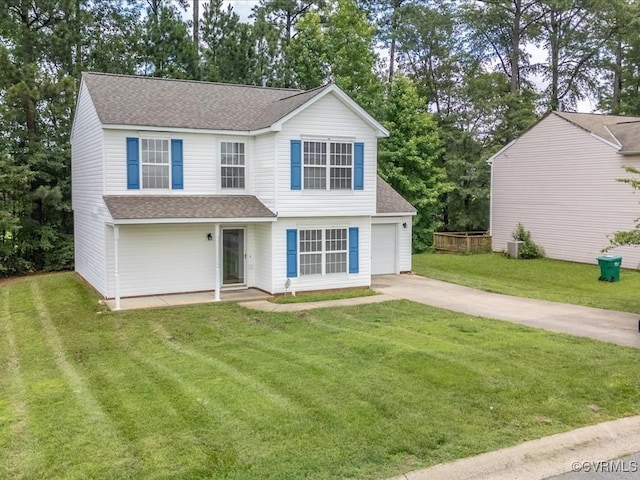 1624 Harvest Grove Ln, Henrico, VA 23223 - view of front of home with roof with shingles, driveway, a front yard, and view of wooded area