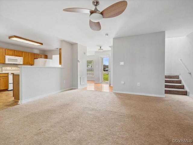 1624 Harvest Grove Ln, Henrico, VA 23223 - unfurnished living room with light carpet, ceiling fan, and stairway