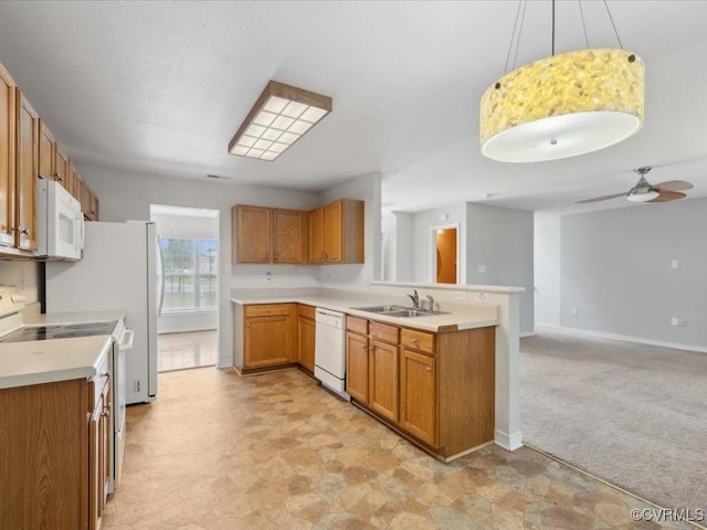 1624 Harvest Grove Ln, Henrico, VA 23223 - kitchen featuring white appliances, a peninsula, brown cabinetry, light countertops, and hanging light fixtures