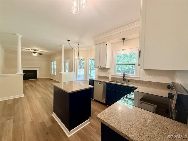 10342 Brickerton Dr, Mechanicsville, VA 23116 - kitchen with dishwasher, a kitchen island, stove, light wood-style flooring, and decorative light fixtures