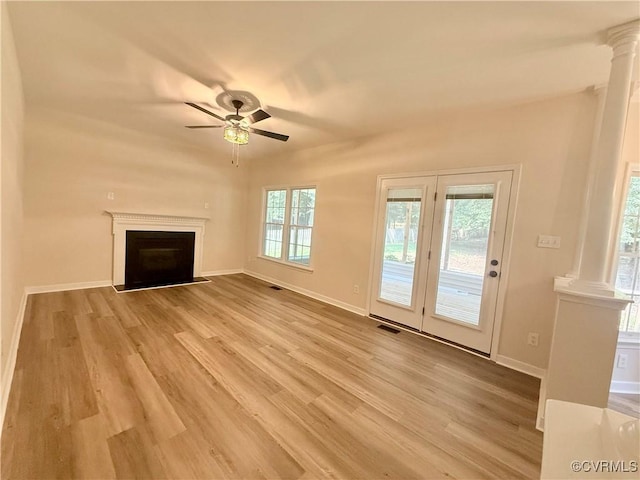 10342 Brickerton Dr, Mechanicsville, VA 23116 - unfurnished living room with ornate columns, light wood finished floors, ceiling fan, and a fireplace with flush hearth