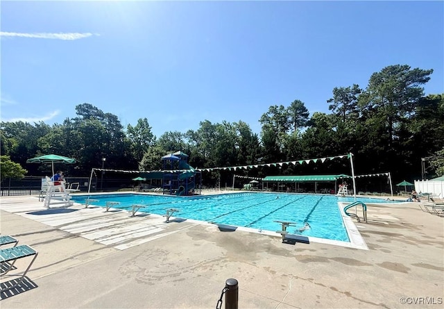 10342 Brickerton Dr, Mechanicsville, VA 23116 - community pool with a patio and view of scattered trees