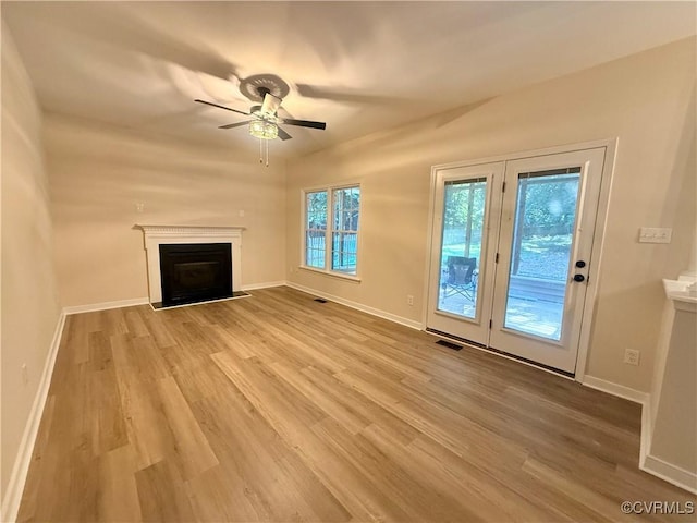 10342 Brickerton Dr, Mechanicsville, VA 23116 - unfurnished living room featuring a fireplace with flush hearth, light wood-type flooring, and a ceiling fan