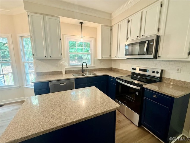 10342 Brickerton Dr, Mechanicsville, VA 23116 - kitchen with stainless steel appliances, light wood-type flooring, ornamental molding, and white cabinets