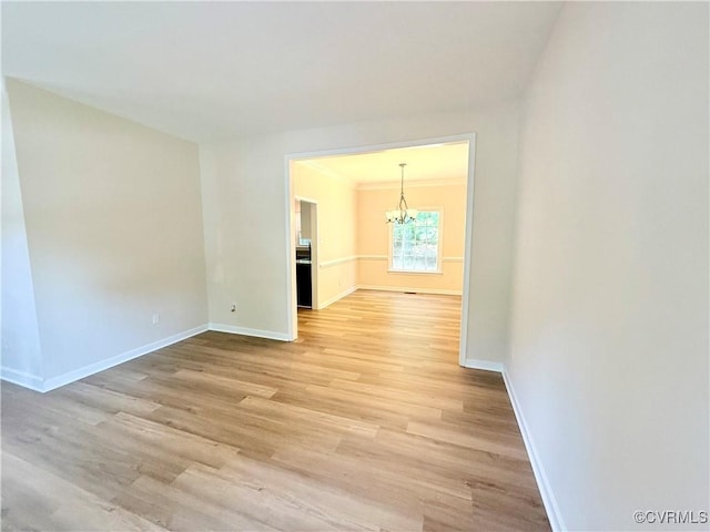 10342 Brickerton Dr, Mechanicsville, VA 23116 - empty room with a chandelier, light wood finished floors, and ornamental molding