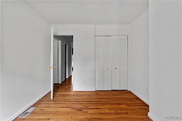 10 Skipwith Green Cir, Henrico, VA 23294 - unfurnished bedroom with wood finished floors and a closet