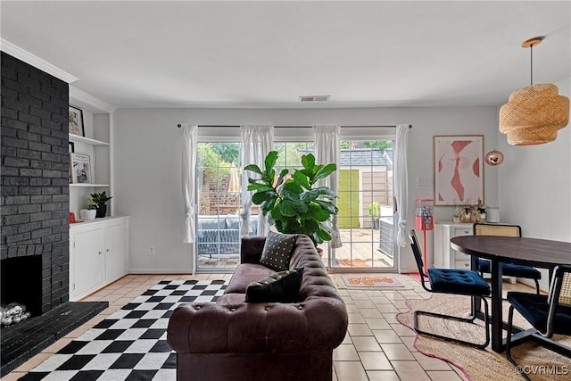 10 Skipwith Green Cir, Henrico, VA 23294 - living room featuring healthy amount of natural light, a brick fireplace, and tile patterned floors