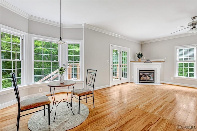 16494 Connie Hall Rd, Montpelier, VA 23192 - dining area featuring light wood-style floors, ceiling fan, crown molding, and a fireplace