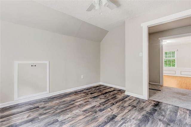 16494 Connie Hall Rd, Montpelier, VA 23192 - additional living space with wood finished floors, ceiling fan, vaulted ceiling, and a textured ceiling