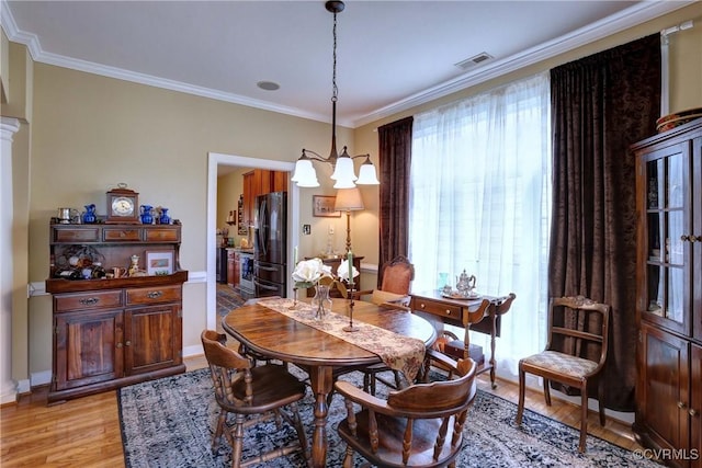 5669 Virginia Park Dr, Providence Forge, VA 23140 - dining room with a chandelier, light wood-style floors, and ornamental molding