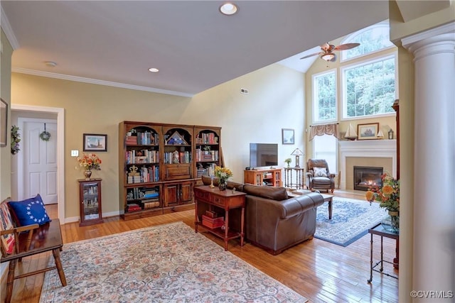 5669 Virginia Park Dr, Providence Forge, VA 23140 - living room featuring a ceiling fan, ornate columns, a glass covered fireplace, wood finished floors, and crown molding