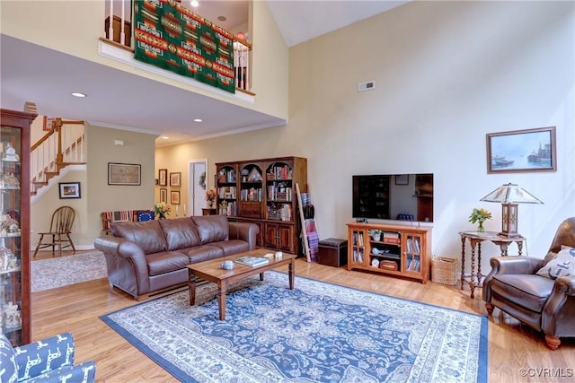 5669 Virginia Park Dr, Providence Forge, VA 23140 - living room with stairs, a towering ceiling, wood finished floors, crown molding, and recessed lighting