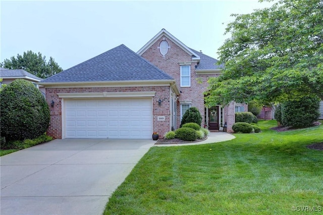 5669 Virginia Park Dr, Providence Forge, VA 23140 - view of front of house featuring brick siding, a front yard, driveway, an attached garage, and roof with shingles