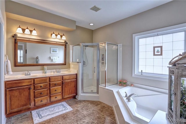 5669 Virginia Park Dr, Providence Forge, VA 23140 - full bathroom with a shower stall, a garden tub, double vanity, and tile patterned flooring
