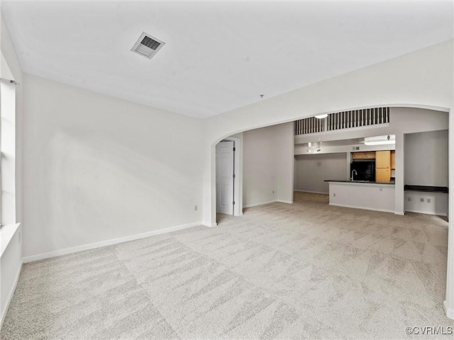 624 Bristol Village Dr Unit 302, Chesterfield, VA 23114 - unfurnished living room featuring arched walkways and carpet flooring