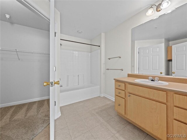 624 Bristol Village Dr Unit 302, Chesterfield, VA 23114 - full bathroom featuring vanity, washtub / shower combination, tile patterned floors, and a walk in closet