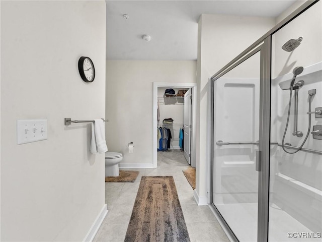 3700 Maze Runner Dr Unit 104, Midlothian, VA 23112 - bathroom with a shower stall, a spacious closet, and tile patterned flooring