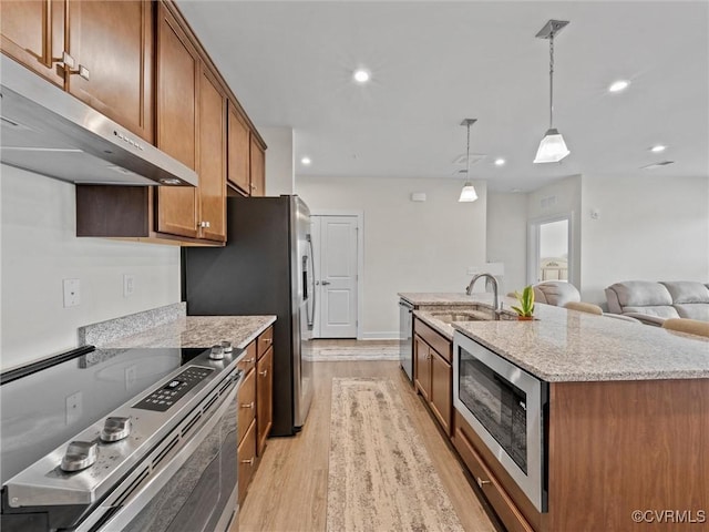 3700 Maze Runner Dr Unit 104, Midlothian, VA 23112 - kitchen with stainless steel appliances, extractor fan, light wood finished floors, brown cabinets, and light stone counters