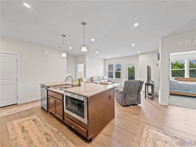 3700 Maze Runner Dr Unit 104, Midlothian, VA 23112 - kitchen with appliances with stainless steel finishes, open floor plan, healthy amount of natural light, light wood finished floors, and recessed lighting