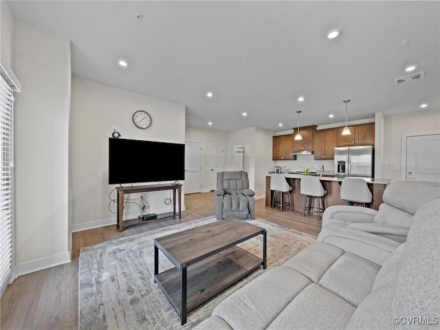 3700 Maze Runner Dr Unit 104, Midlothian, VA 23112 - living area featuring light wood finished floors and recessed lighting