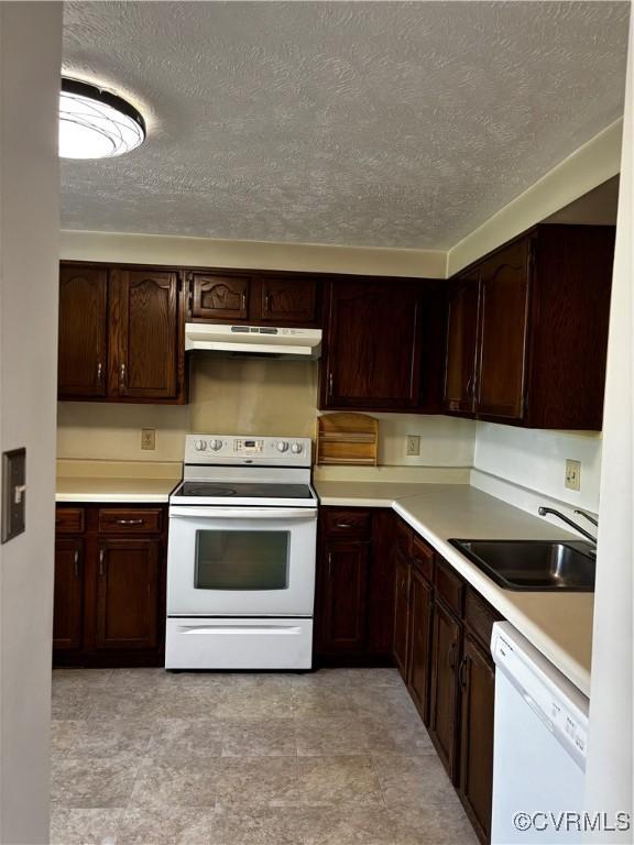 1811 Random Winds Ct, Henrico, VA 23238 - kitchen featuring white appliances, under cabinet range hood, a textured ceiling, light countertops, and dark brown cabinetry