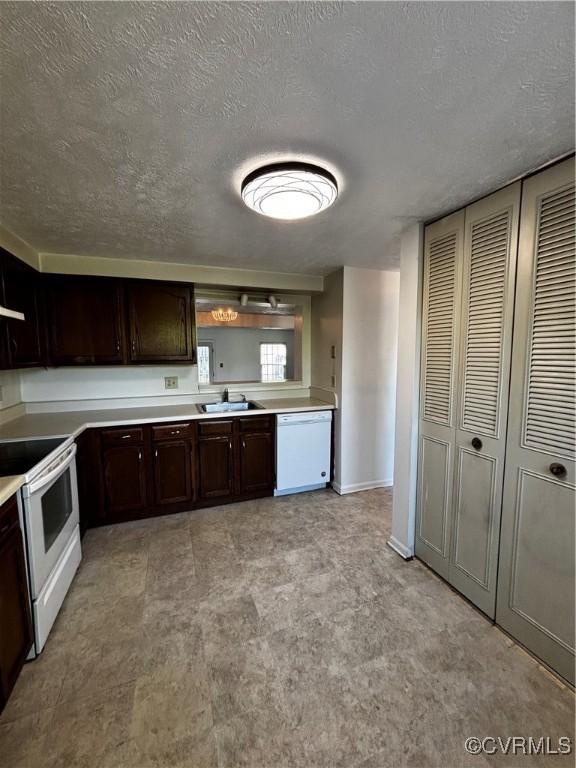 1811 Random Winds Ct, Henrico, VA 23238 - kitchen featuring white appliances, dark brown cabinetry, a textured ceiling, and light countertops