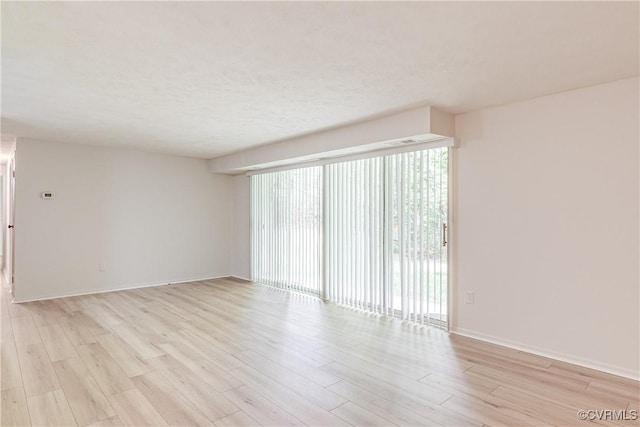 8404 Muldoon Ct Unit 4, Henrico, VA 23228 - spare room featuring light wood-type flooring and a textured ceiling