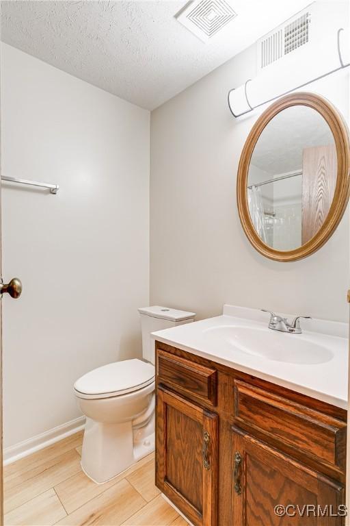 8404 Muldoon Ct Unit 4, Henrico, VA 23228 - full bathroom with vanity, curtained shower, and wood finished floors