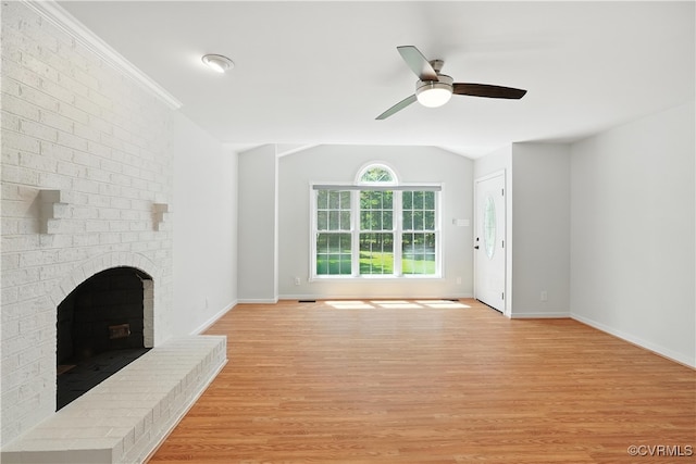15685 Kennons Ln, Amelia, VA 23002 - unfurnished living room with light wood-type flooring, a brick fireplace, a ceiling fan, and vaulted ceiling