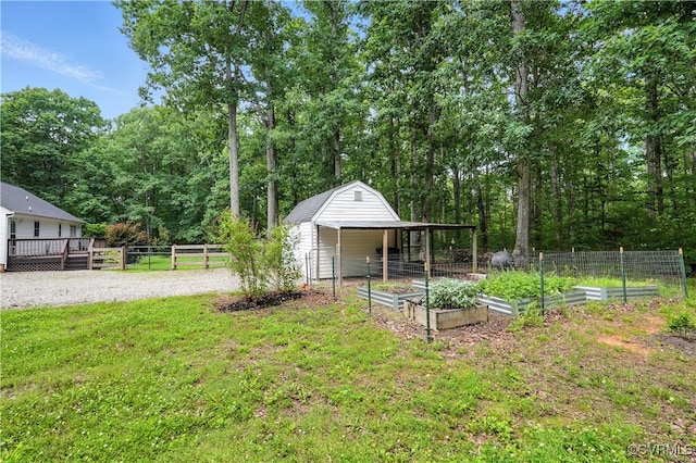 15685 Kennons Ln, Amelia, VA 23002 - view of yard with a vegetable garden, an outbuilding, and a deck