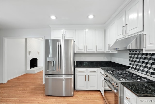 15685 Kennons Ln, Amelia, VA 23002 - kitchen featuring appliances with stainless steel finishes, under cabinet range hood, white cabinets, light wood-style flooring, and recessed lighting