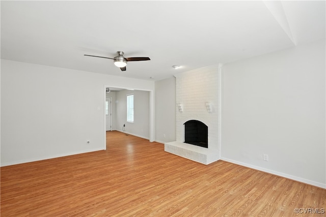 15685 Kennons Ln, Amelia, VA 23002 - unfurnished living room featuring light wood-style flooring, ceiling fan, and a fireplace