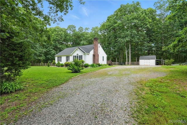 15685 Kennons Ln, Amelia, VA 23002 - view of front of home with driveway, a chimney, an outbuilding, and a carport