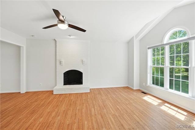 15685 Kennons Ln, Amelia, VA 23002 - unfurnished living room featuring light wood-type flooring, a fireplace, a ceiling fan, and lofted ceiling