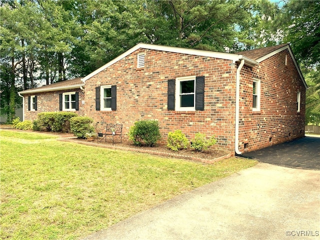 12027 Old Buckingham Rd, Midlothian, VA 23113 - view of side of home with a yard, brick siding, and asphalt driveway