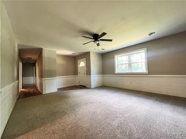 12027 Old Buckingham Rd, Midlothian, VA 23113 - carpeted empty room featuring a wainscoted wall and ceiling fan