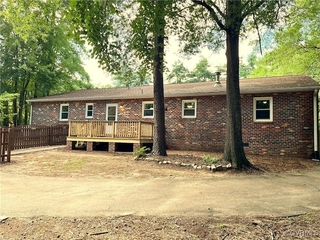 12027 Old Buckingham Rd, Midlothian, VA 23113 - back of property with a wooden deck and brick siding