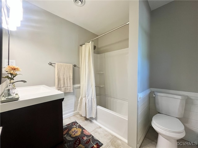 12027 Old Buckingham Rd, Midlothian, VA 23113 - bathroom with vanity, shower / bath combination with curtain, wainscoting, and tile patterned floors