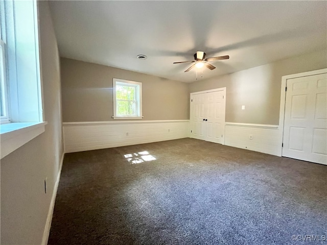 12027 Old Buckingham Rd, Midlothian, VA 23113 - carpeted spare room featuring wainscoting and ceiling fan