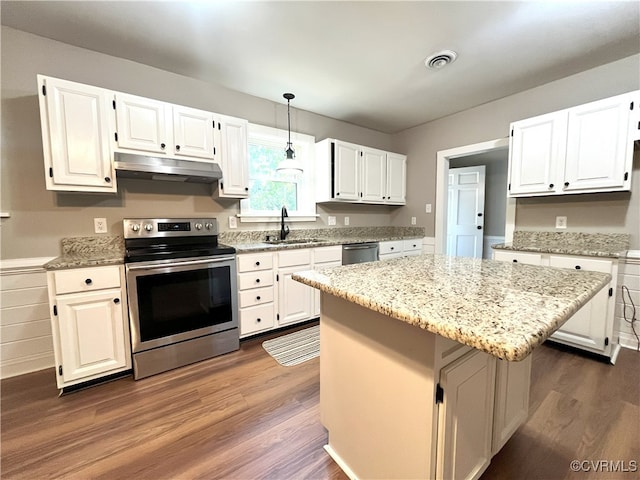 12027 Old Buckingham Rd, Midlothian, VA 23113 - kitchen featuring stainless steel appliances, under cabinet range hood, dark wood-style floors, and light stone countertops