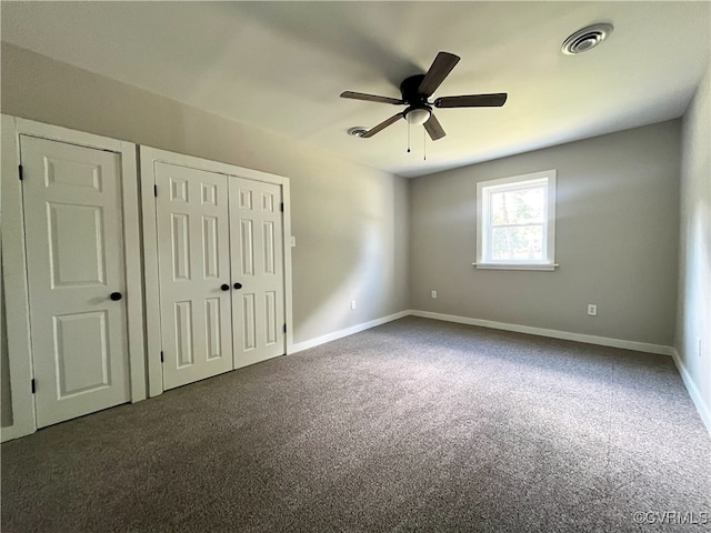 12027 Old Buckingham Rd, Midlothian, VA 23113 - unfurnished bedroom featuring dark colored carpet, a closet, and ceiling fan