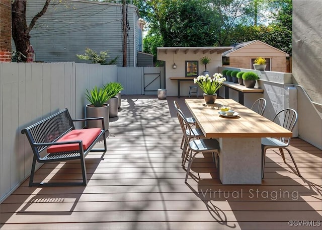 2921 E Marshall St, Richmond, VA 23223 - wooden deck with a gate and outdoor dining area