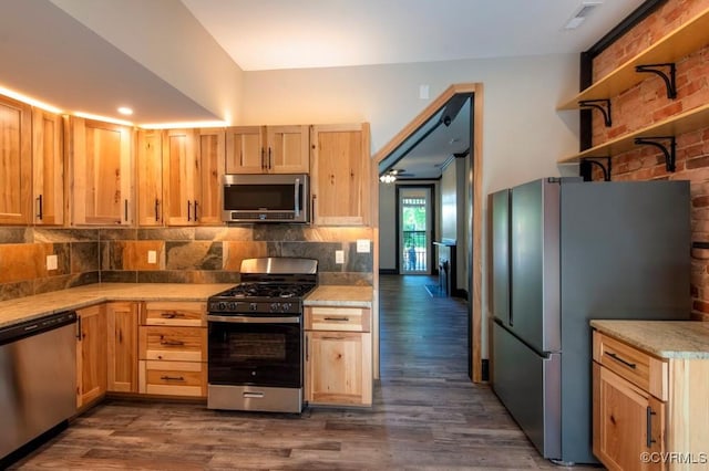 2921 E Marshall St, Richmond, VA 23223 - kitchen with stainless steel appliances, decorative backsplash, light countertops, dark wood-style floors, and light brown cabinets