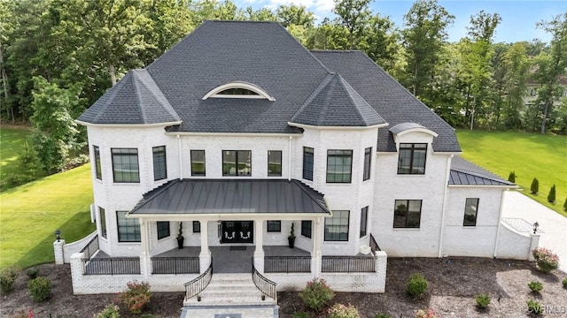 12313 Haybrook Ln, Henrico, VA 23059 - french country inspired facade with a front yard, a standing seam roof, a metal roof, and covered porch