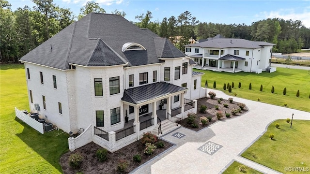 12313 Haybrook Ln, Henrico, VA 23059 - view of front facade featuring a porch, a standing seam roof, a front yard, and a metal roof